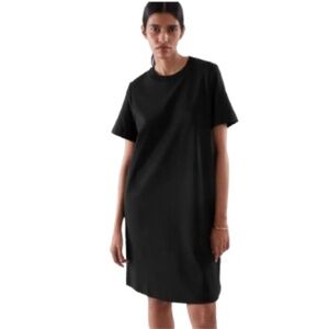 COS black shirt dress with short sleeves and u-shaped neckline stained